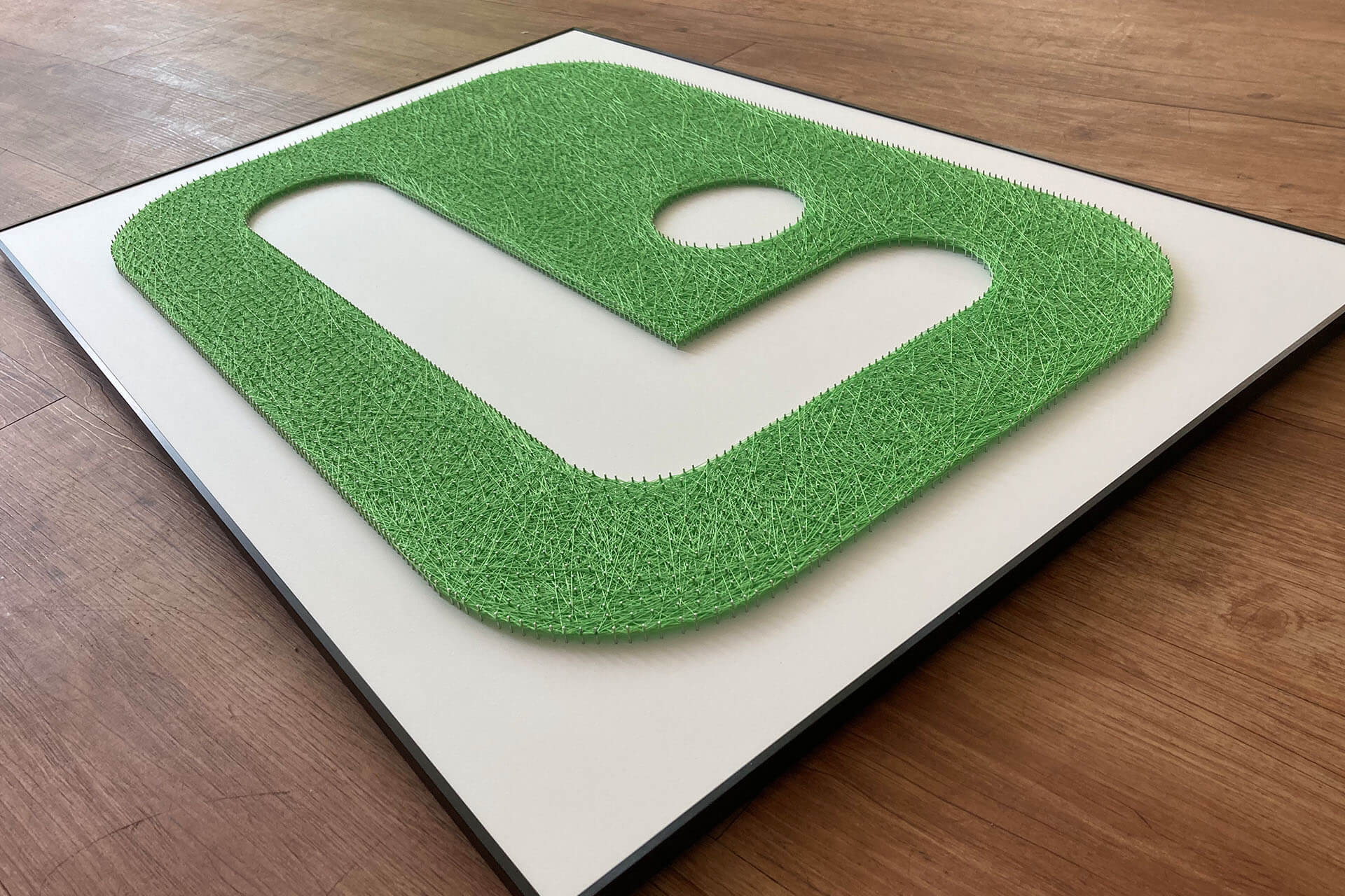 Nagelbild Bürosysteme Lilienthal, Logo Sonderfarbe grün moll-real